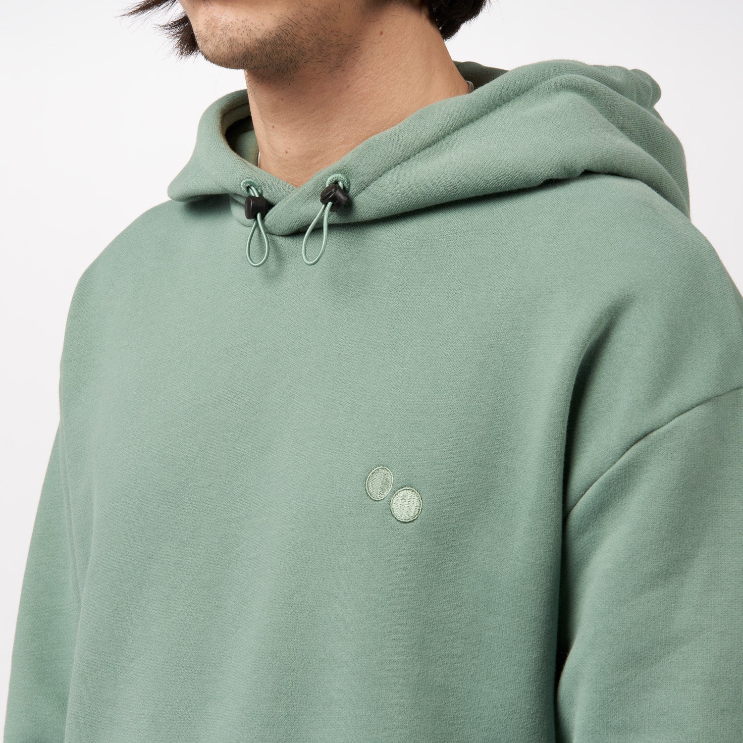 pinqponq-Hoodie-Monstera-Green-unisex-model-front