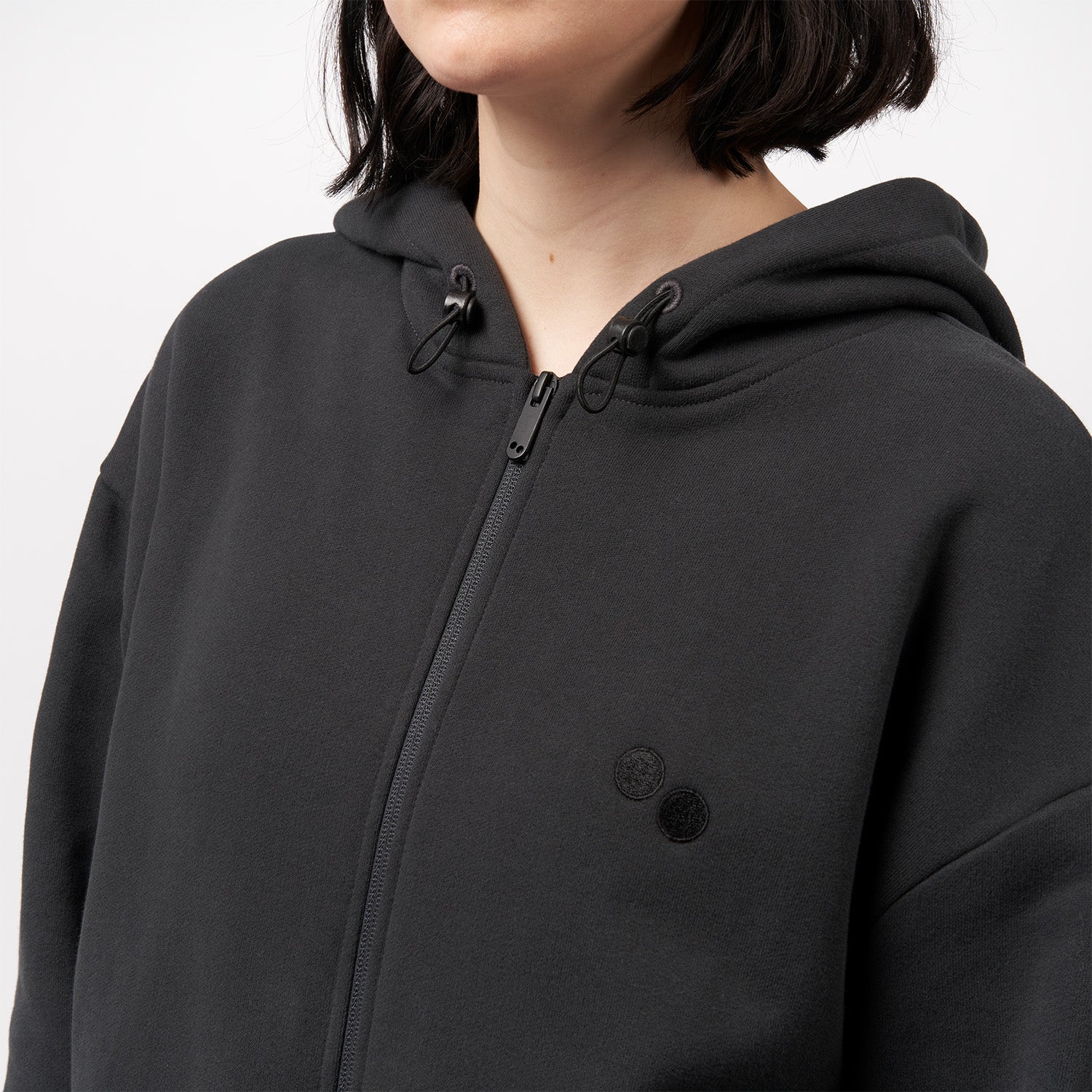 pinqponq-Zipped-Hoodie-Peat-Black-unisex-model-front