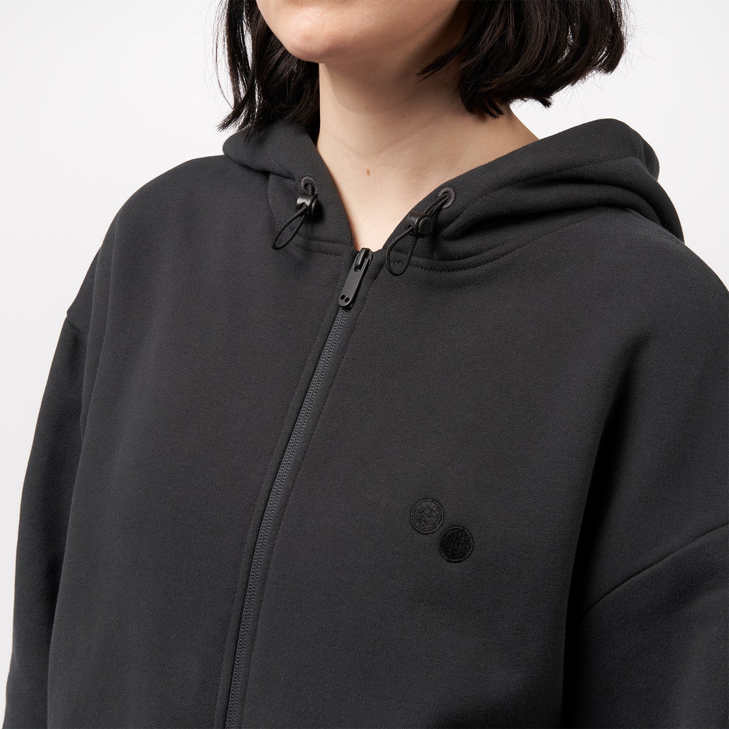 pinqponq-Zipped-Hoodie-Peat-Black-unisex-model-front